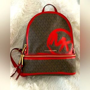 Michael Kors backpack used 1x Brown w/red painted swipes. Beautiful rare find.